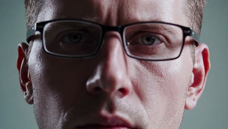 close-up portrait of a man wearing glasses