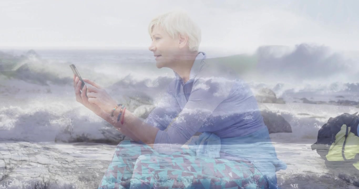 Wave sounds initiating shot dissolving into woman tapping smartphone browsing technology content