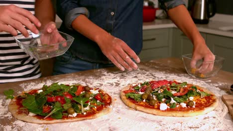 Smiling-couple-preparing-pizza