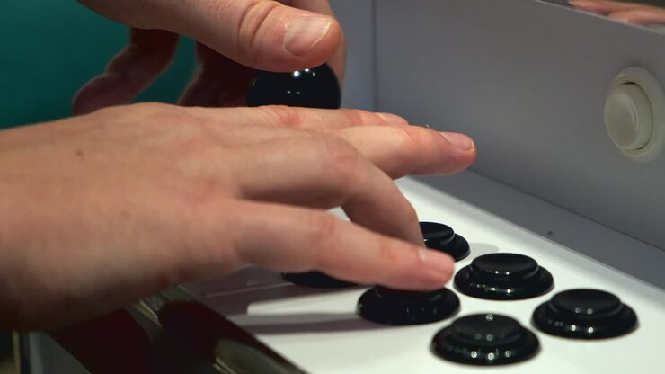 Person playing an arcade game