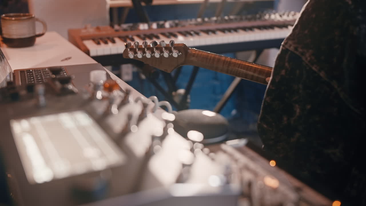 Musician Playing Guitar in Recording Studio