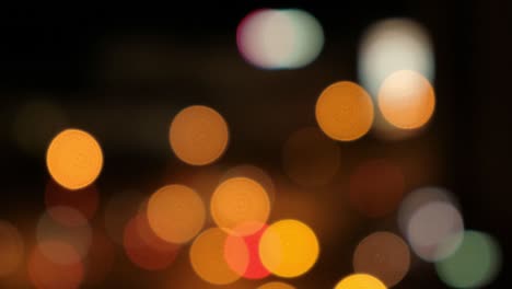 blurred bokeh light spots on black background.