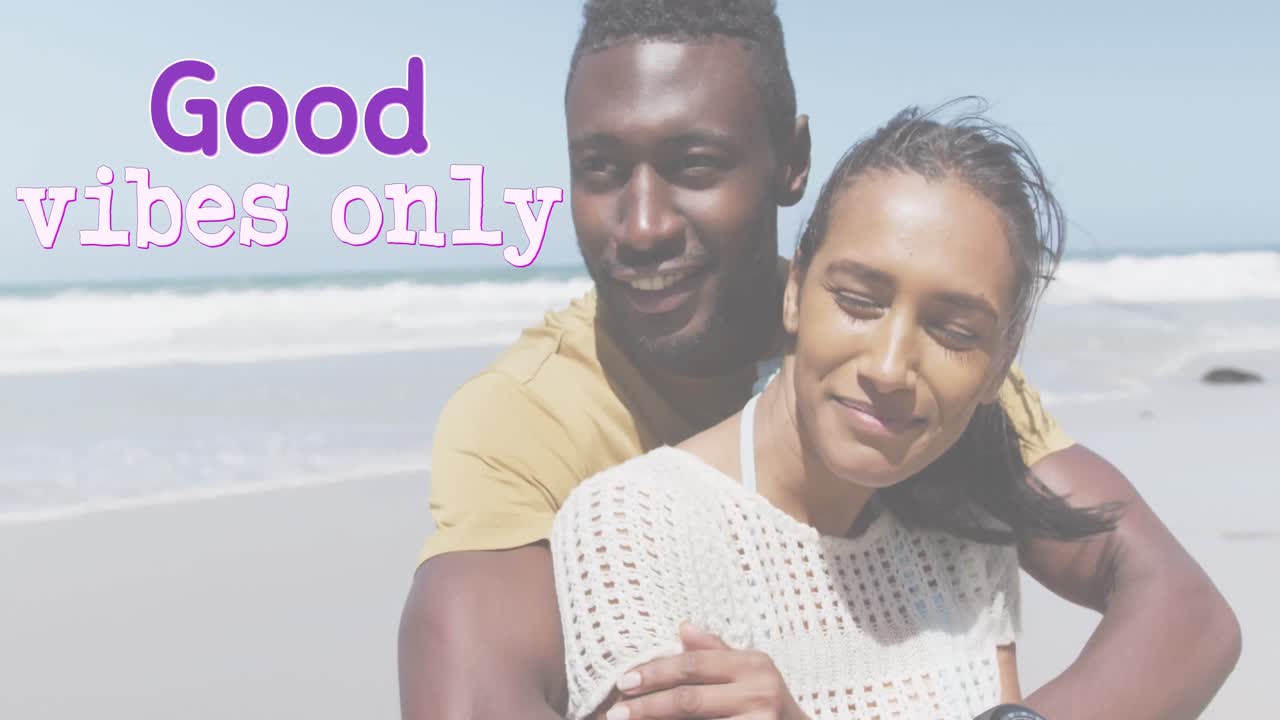Animation of the words good vibes only in purple over happy couple embracing on beach
