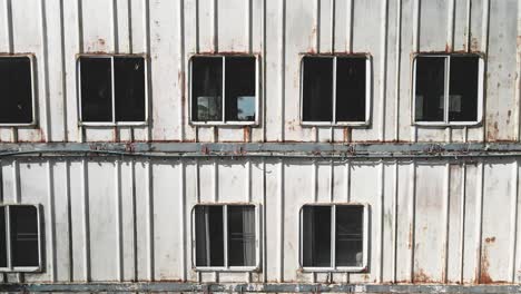 rusted steel  abandoned ship windows panning shot