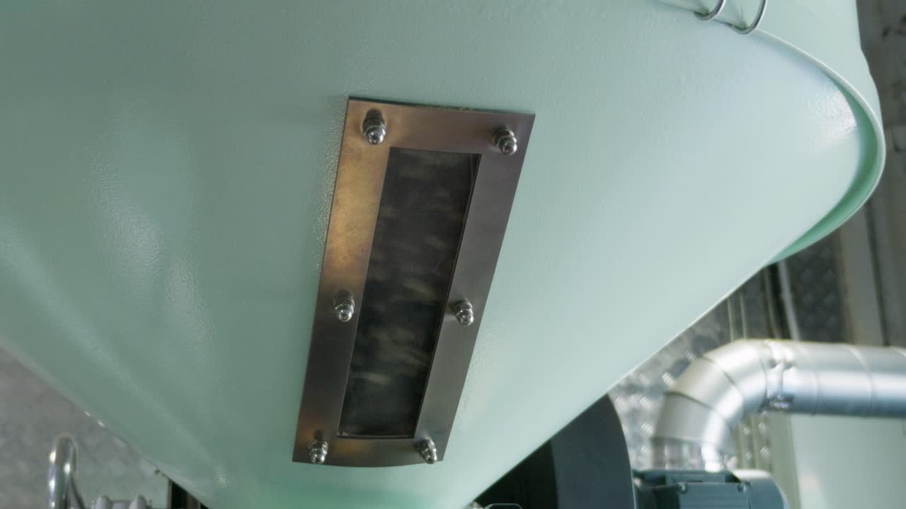 Explore the intricate machinery behind brewing coffee showcasing the process in an industrial setting.