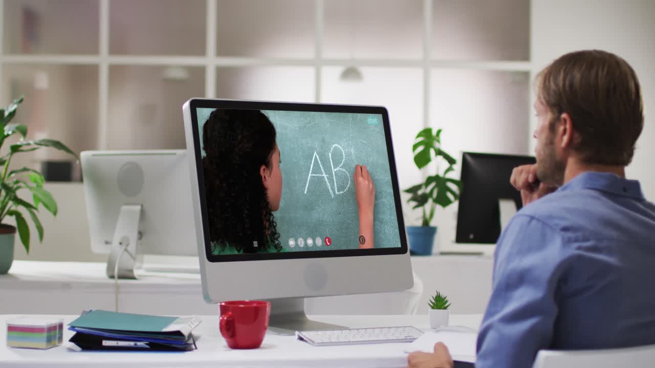 Caucasian male student using computer on video call with female teacher