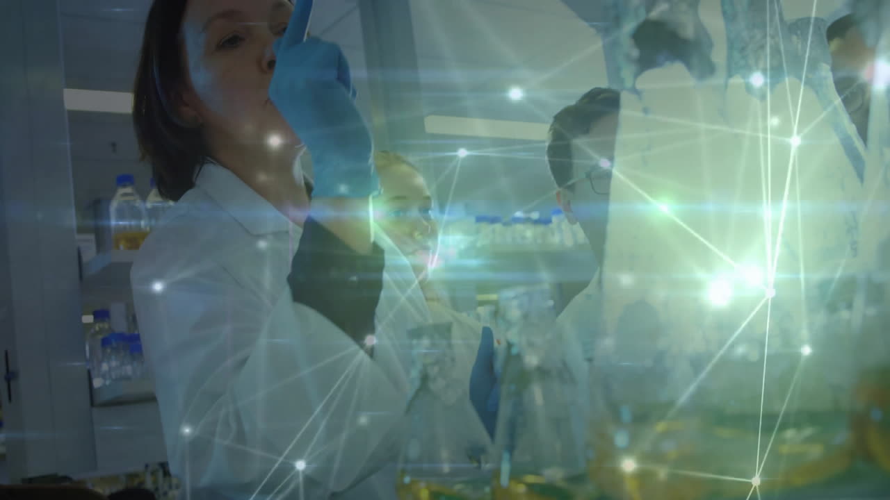 Scientists analyzing data with network connections animation overlay in laboratory