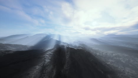 Alpine chains shrouded in the morning fog