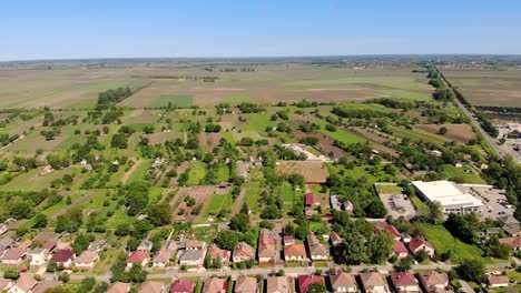 flying above the edge of a hungarian town by drone on a sunny day