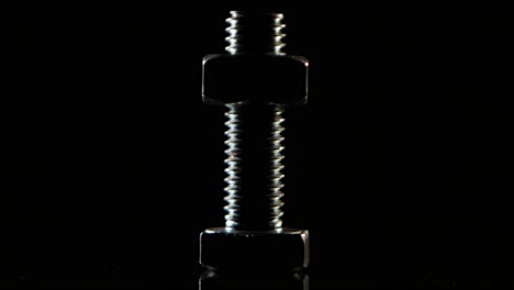 bolt and nut on a dark background
