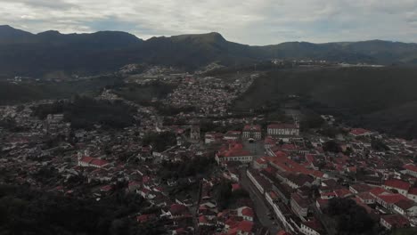 historic colonial city centre of ouro preto, minas gerais, brazil seen from the são sebastião viewpoint with itacolomi mountain in the background on an overcast morning