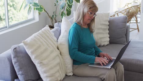 Senior-woman-using-laptop-at-home