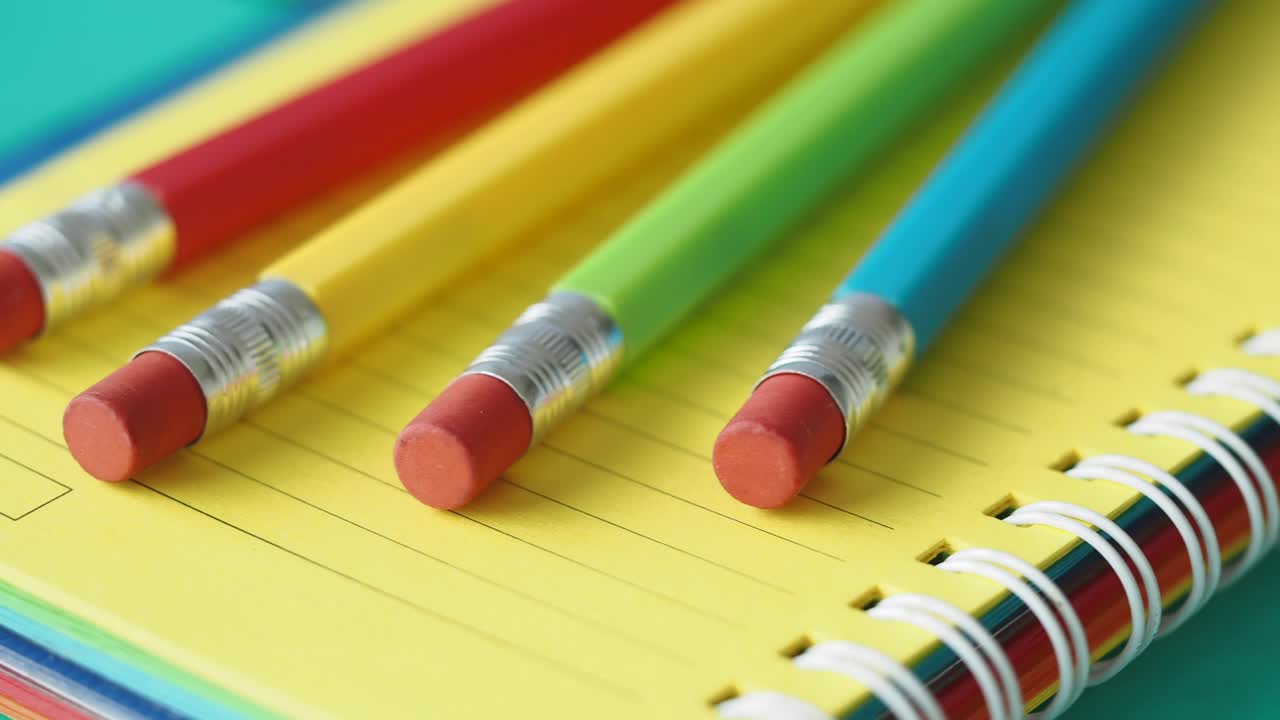 Colorful Pencils on a Spiral Notebook