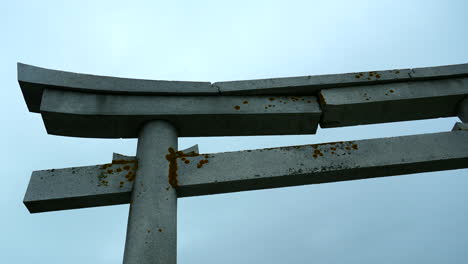 damaged stone torii gate