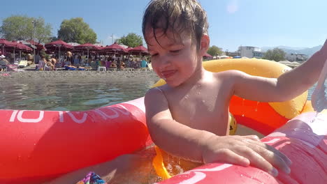 boy having fun in sunny day at the sea