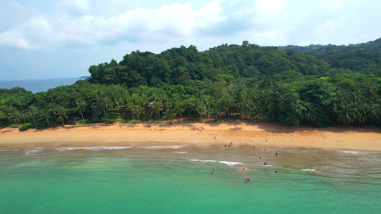Aerial view from Bom Bom beach with people in water. Prince Island,Sao Tome,Africa