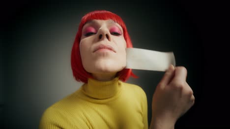 woman with red hair and yellow sweater