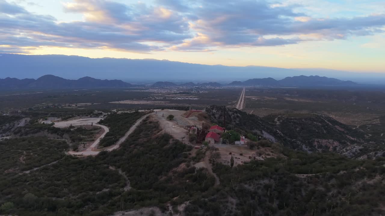 Estación 2 Cable Carril historic mining site and red-roofed buildings, surrounded by mountains near Chilecito, La Rioja, Argentina