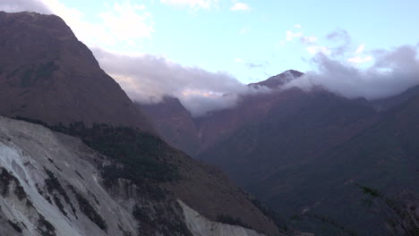 a view of a large devastating landslide in a remote region of nepal.