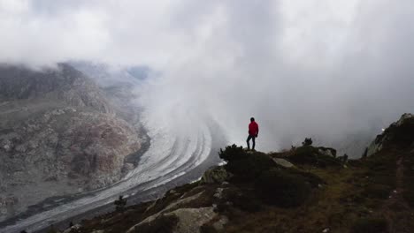 aerial passes really close from a person that enjoys the view over aletsch glacier