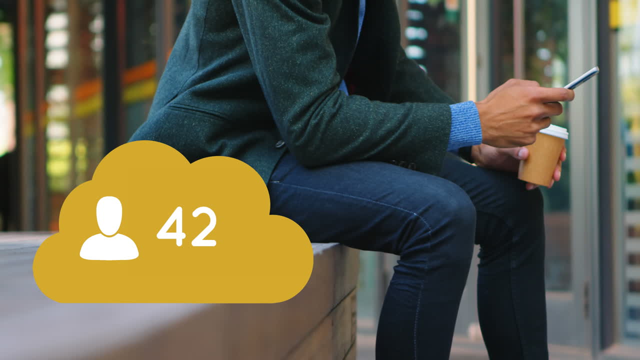 Man sitting on a brick platform checking his phone 4k