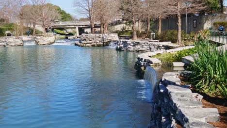 weir of water cascading down river scenic shot of city tourist spot static shot