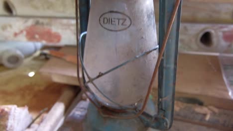 old antique retro lantern in messy workshop