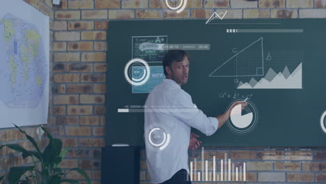 animation of diagrams and data processing over caucasian male teacher writing on board