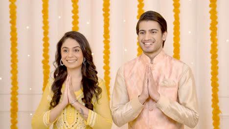 indian couple doing namaste