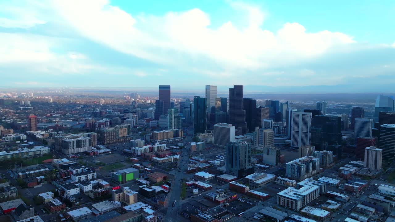 Downtown Denver Rhino art district spring summer after rain thunderstorm aerial drone Colorado cityscape landscape buildings sunny blue skies cloudy afternoon cars traffic upwards motion