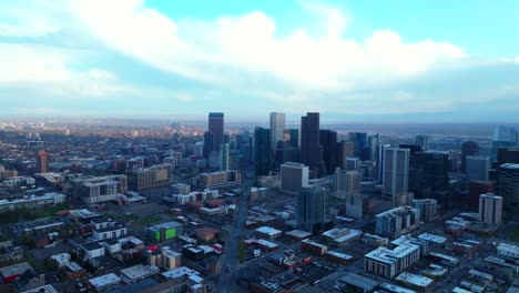 downtown denver rhino art district spring summer after rain thunderstorm aerial drone colorado cityscape landscape buildings sunny blue skies cloudy afternoon cars traffic upwards motion