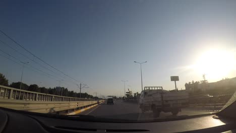 city, nature and traffic view from the camera inside the vehicle.