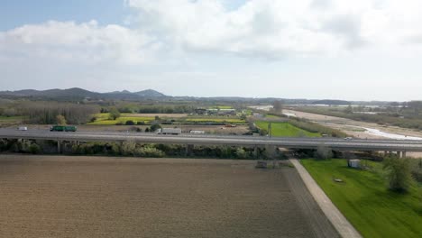 Aerial-rising-shot-of-traffic-on-Spanish-highway-towards-Barcelona