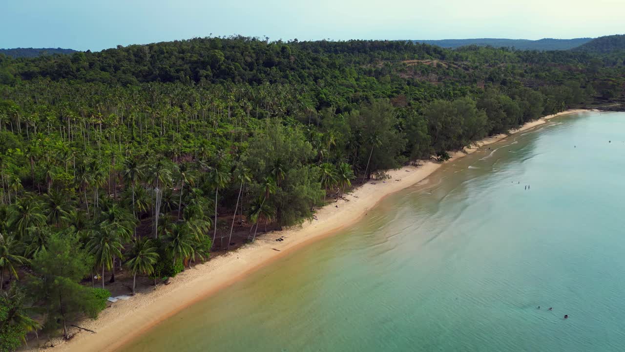 lonely beach with turquoise water and green forest in Koh Rong, Cambodia. Fantastic aerial view flight panorama overview drone