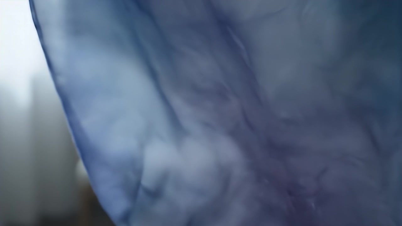 Blue and Purple Silk Fabric Flowing in the Wind