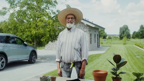 smiling senior gardener in his backyard