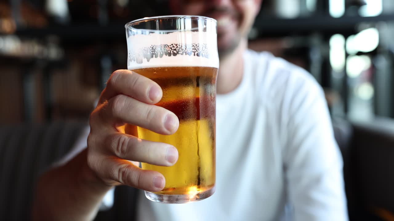 Man Toasting with a Pint of Beer