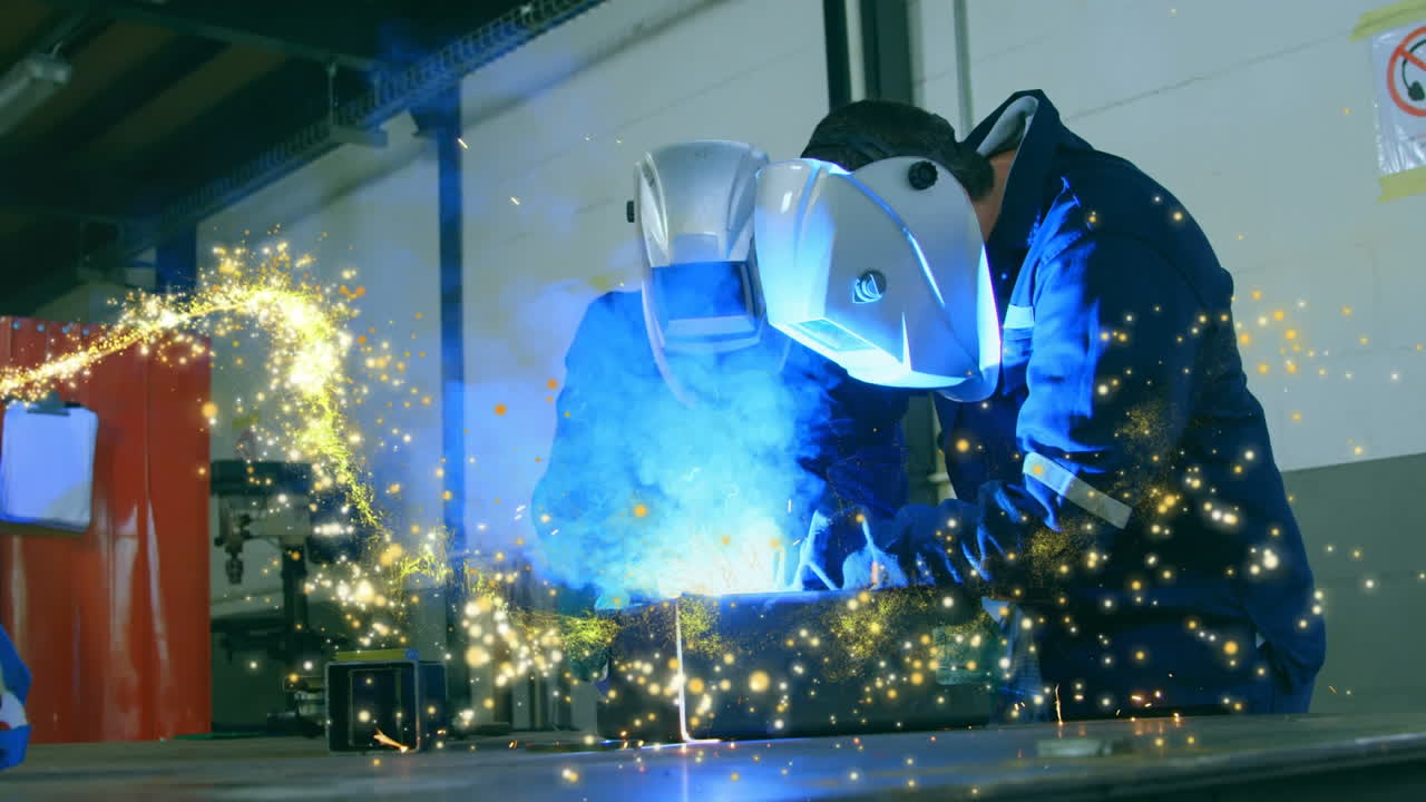 Animation of glowing shooting star over male engineers welding
