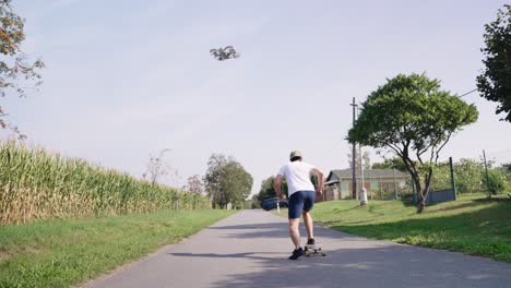 athletic guy use drone to track activity while skateboarding, czechia