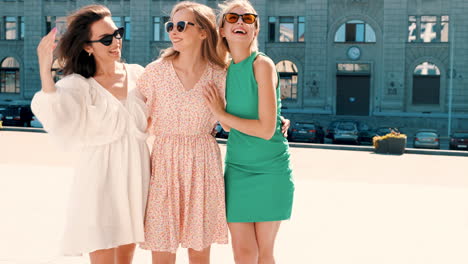 three women friends enjoying a summer day in the city