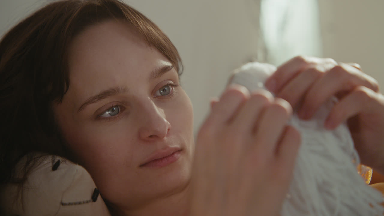 A girl playing with dolls in her room