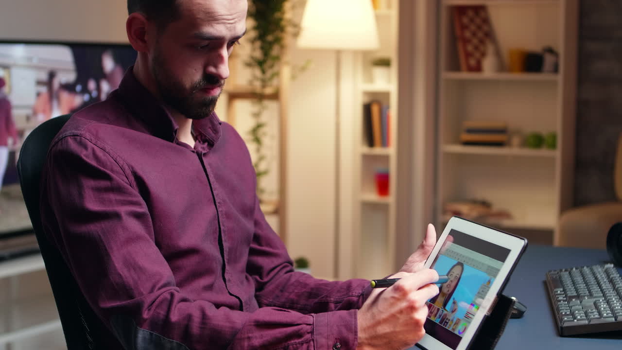 Art director retouching photo on tablet computer