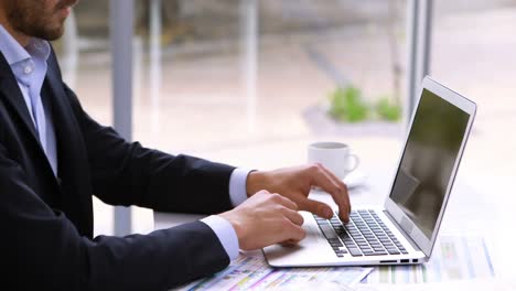 tired businessman resting head on laptop at desk 4k