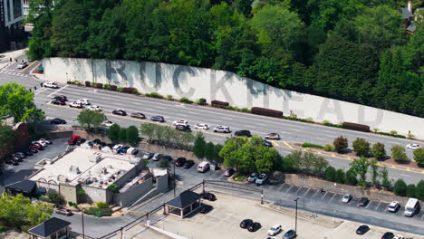 lenox road traffic by the buckhead wall in atlanta, georgia