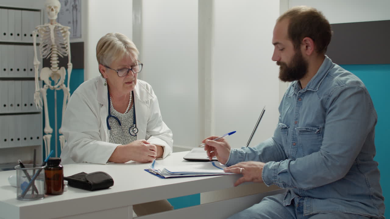 Sick patient signing checkup documents to receive medication