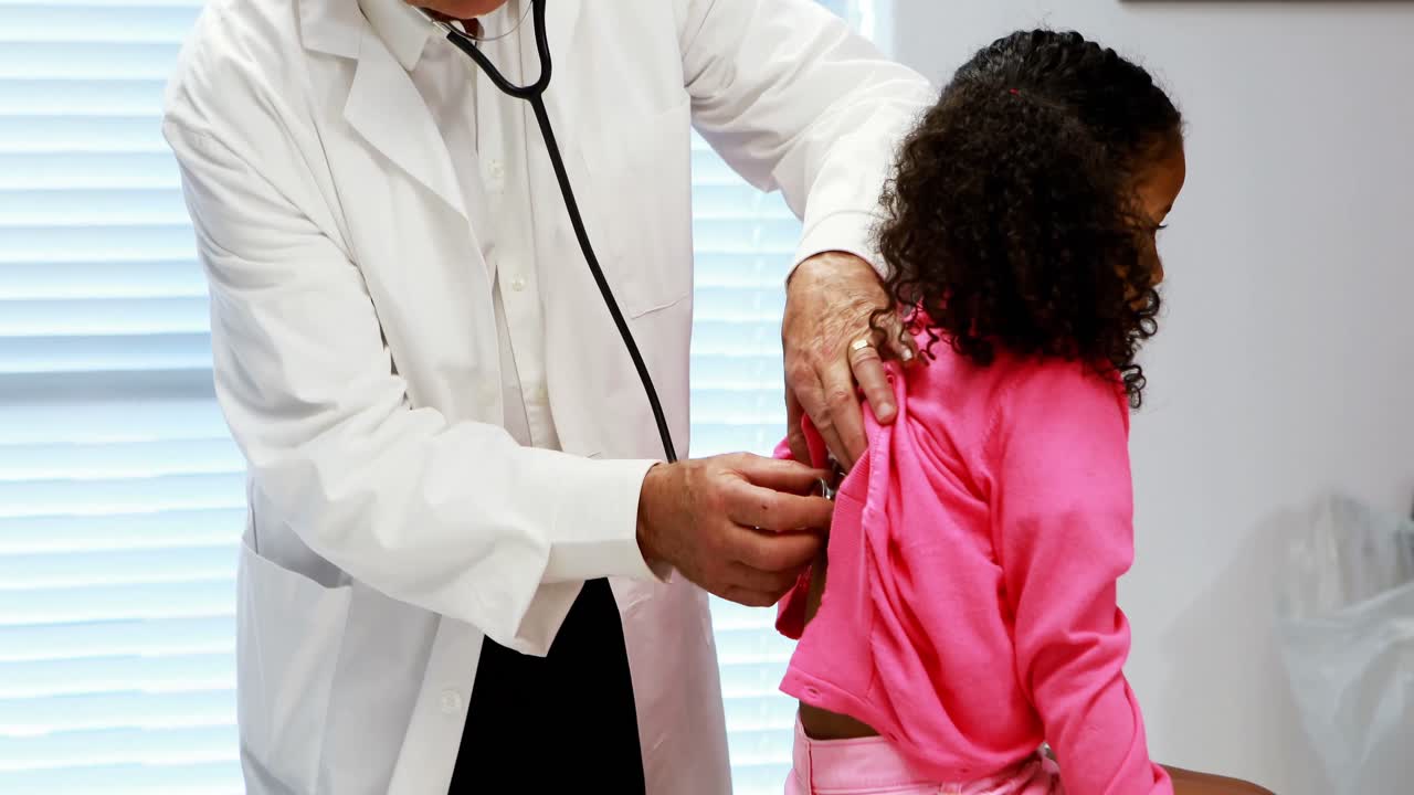 Male doctor examining a patient