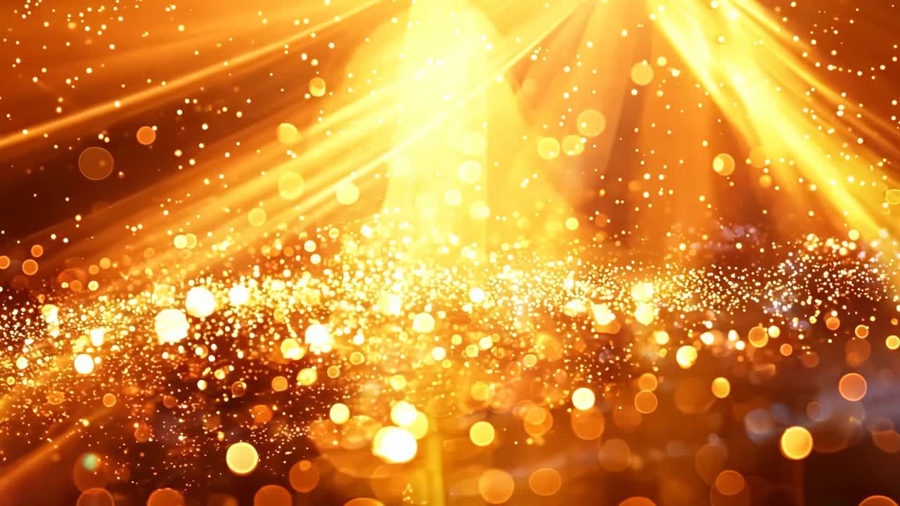 A bright orange background with a lot of glitter. The glitter is scattered all over the background, creating a sense of movement and energy