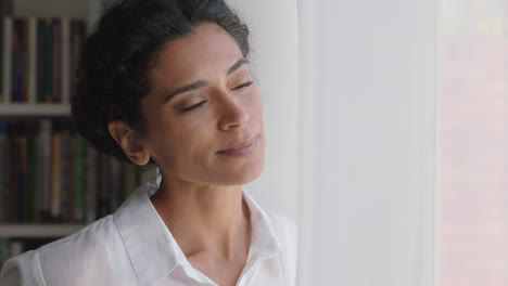 beautiful-mixed-race-woman-looking-out-window-at-home-enjoying-fresh-new-day-feeling-rested-thinking-planning-ahead-4k-footage