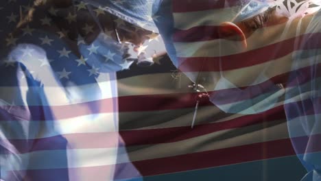 Animation-Der-Flagge-Der-Vereinigten-Staaten-Von-Amerika,-Die-über-Chirurgen-Im-Operationssaal-Weht