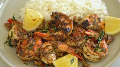 jerk shrimps or grilled shrimps in jamaica style with lemon and rice